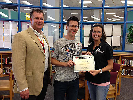 North Lamar HS Principal Clint Hildreth, winner Carson Rast, LMS Restoration Director of Communications Mahona Kinabrew